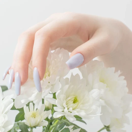 female-hands-with-beautiful-manicure-chrysanthemum-flowers-2-scaled-1.webp